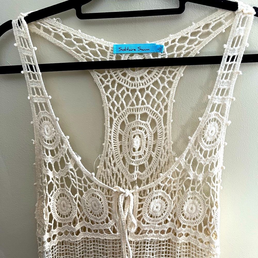 Off white crocheted pool coverup. I’ve worn this with a slip liner out to dinner